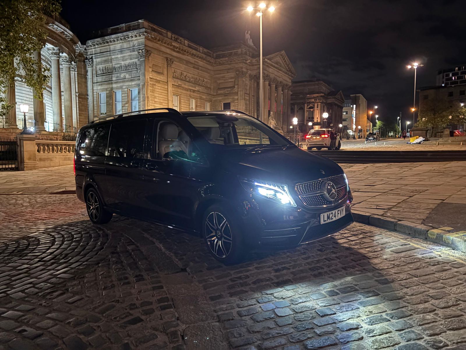 AO Platinum Chauffeurs V-Class in Liverpool city centre at night, near St George's Hall